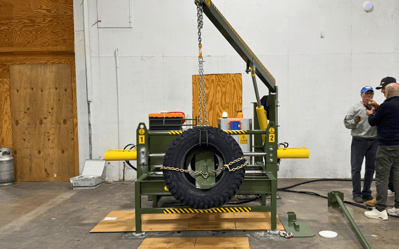 Front view of workshop run-flat tire changing machine with tire loaded